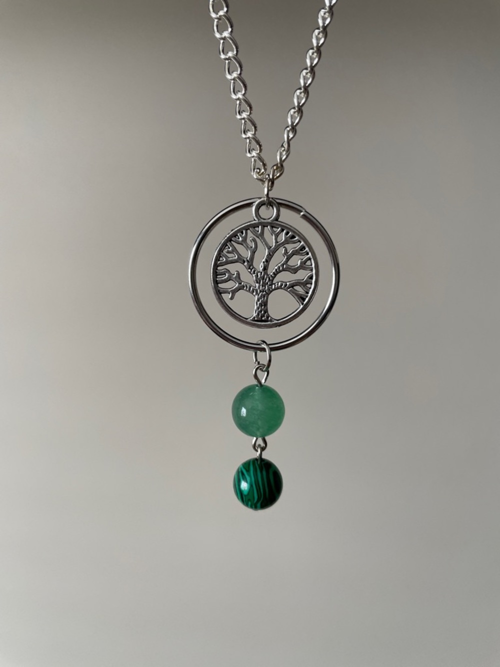 Tree of life hoop green gemstone necklace.